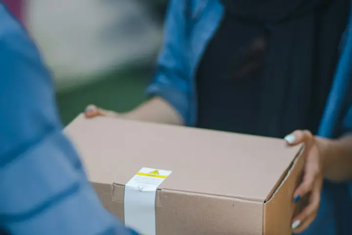 Parcel being handed over for delivery