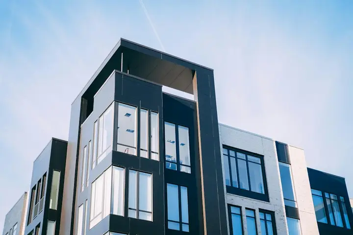 Modern apartment building against a blue sky