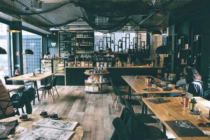 Busy café interior with wooden tables