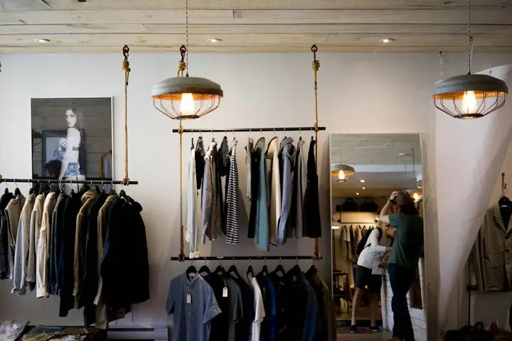 Boutique clothing store with garments on rails