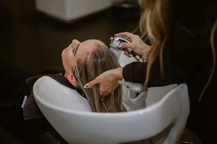 Client having her hair washed at a salon